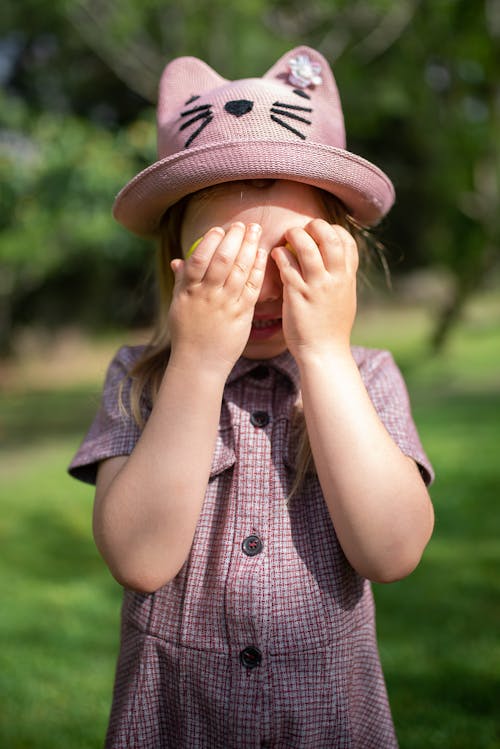 Girl with Hands on Face