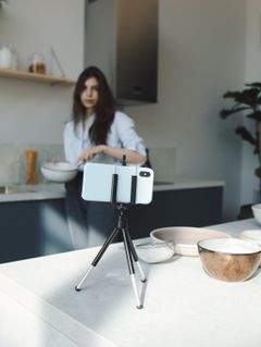 Phone on a tripod filming a countertop scene — photo by Polina Tankilevitch on Pexels