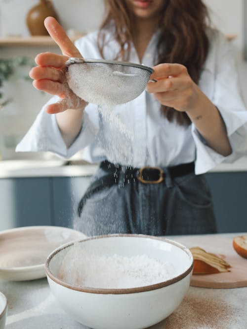 Woman Sifting Flour