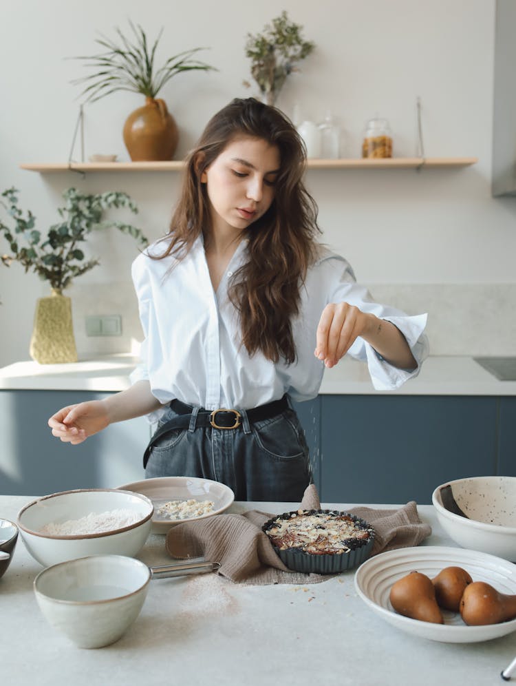 A Woman Making A Pie