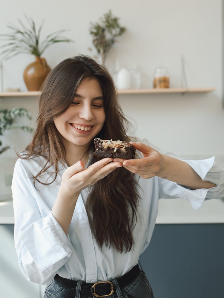 Pretty Woman Eating A Cake