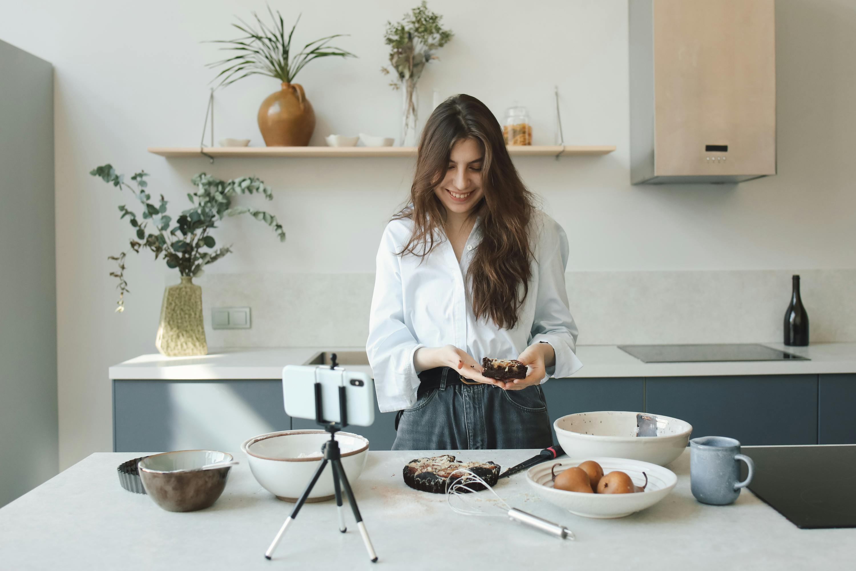 woman holding a chocolate cake