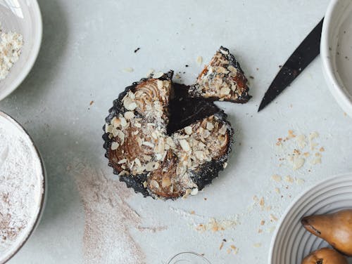 Close Up Photo of Chocolate Cake with Nuts on Top