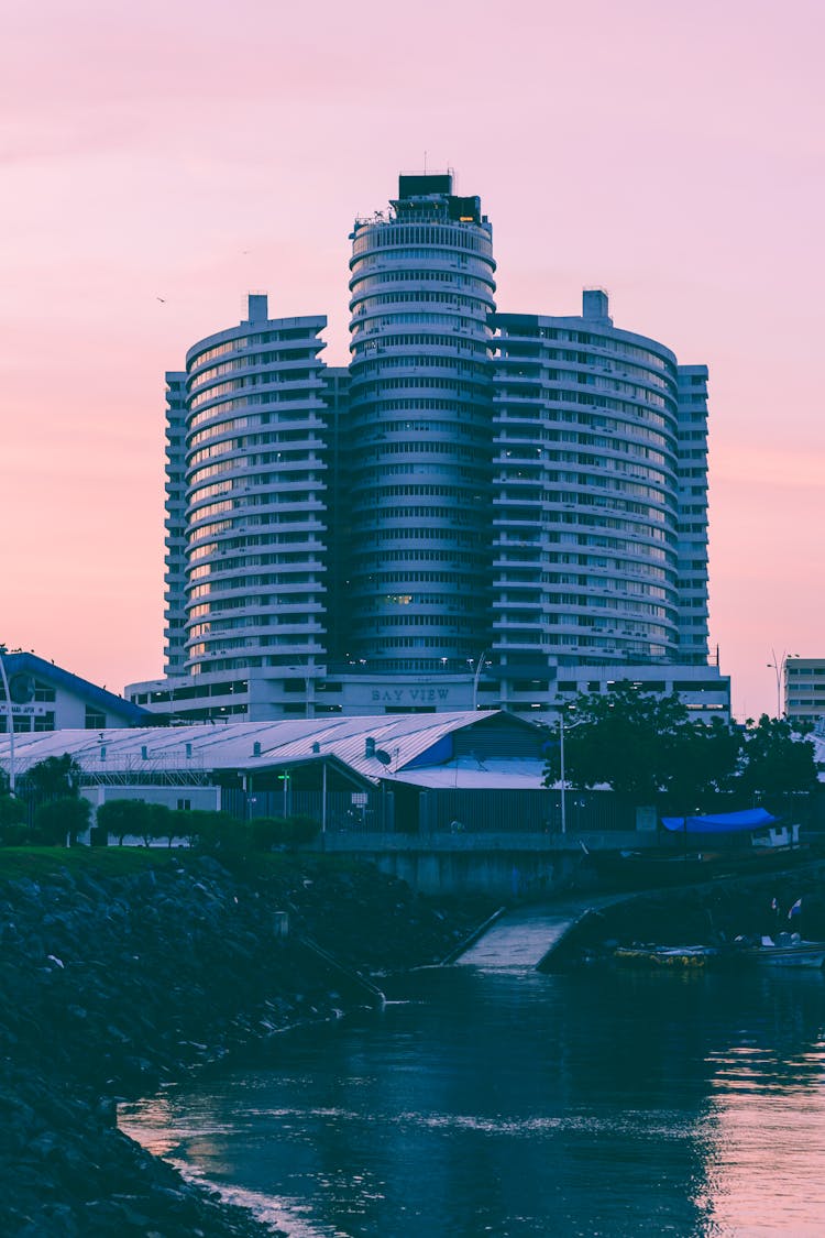 Hotel Near Water At Dusk