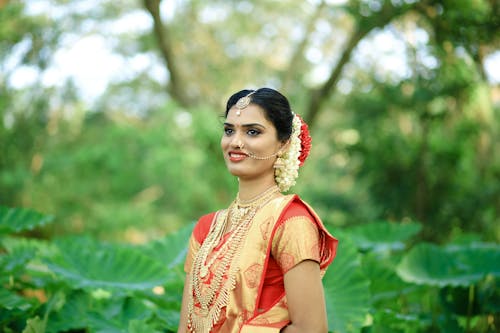 Free Woman in Red and Gold Sari Stock Photo