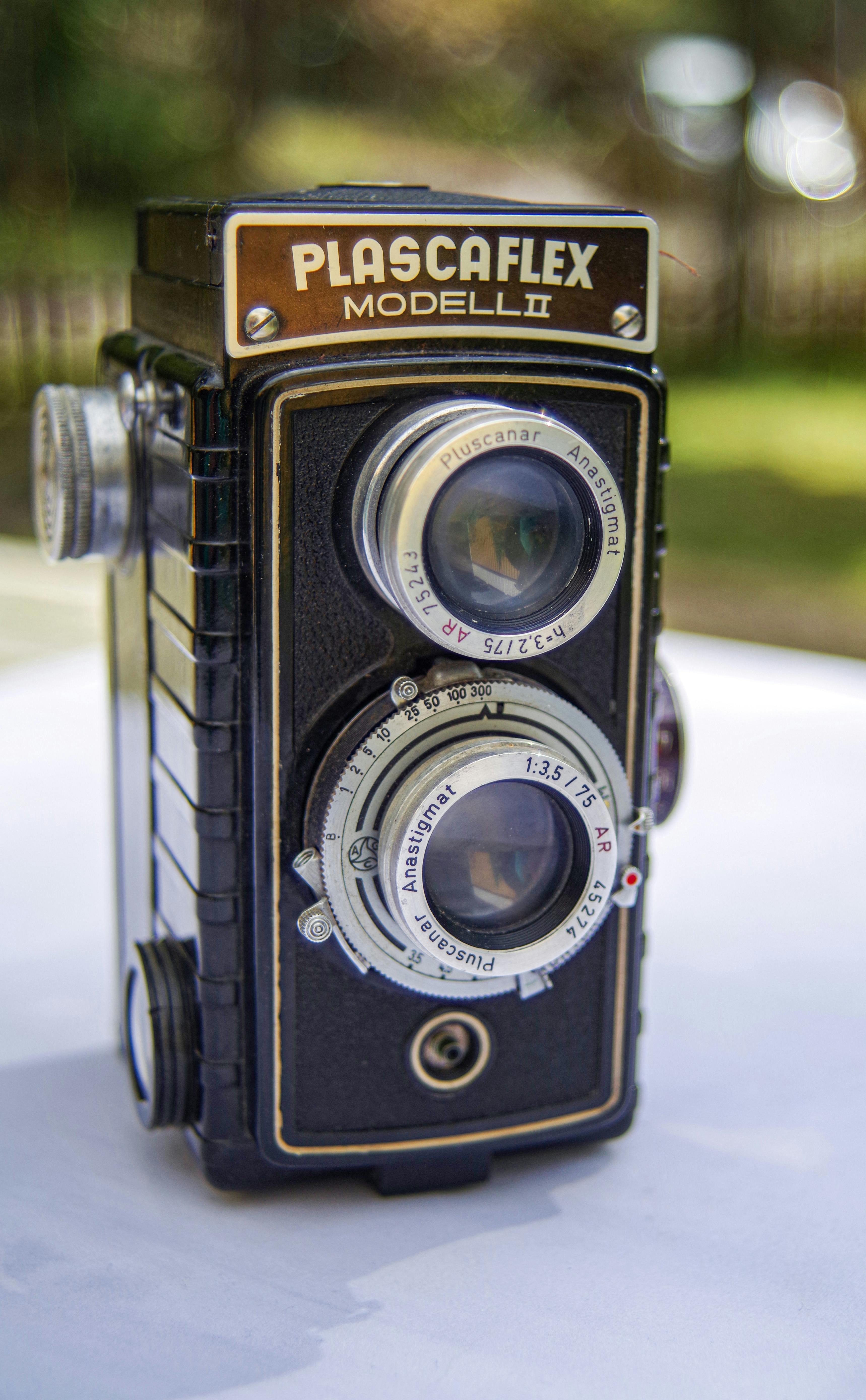 Vintage Camera behind Window in Black and White · Free Stock Photo