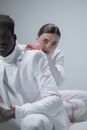 Man in White Dress Shirt Beside Woman in White Long Sleeve Shirt