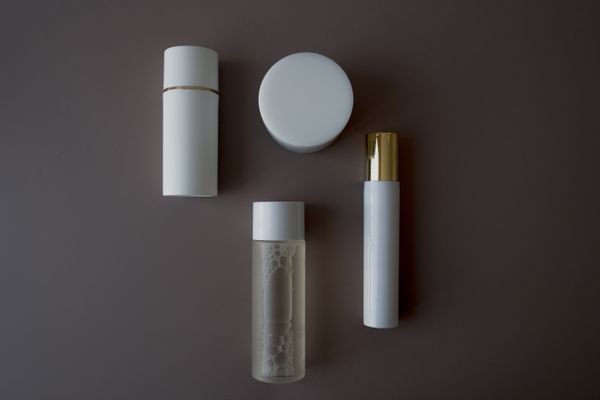 Care bottles and flasks on a neutral background — photo by alleksana on Pexels