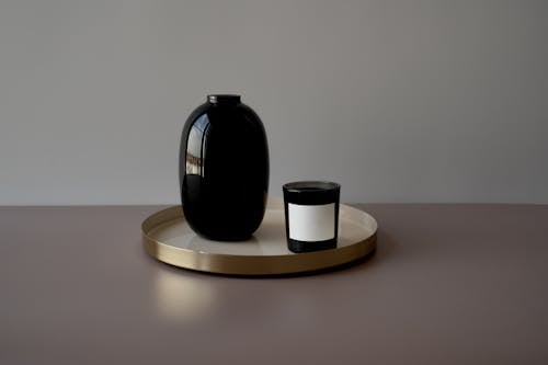 Black Ceramic Mug on Brown Wooden Round Table