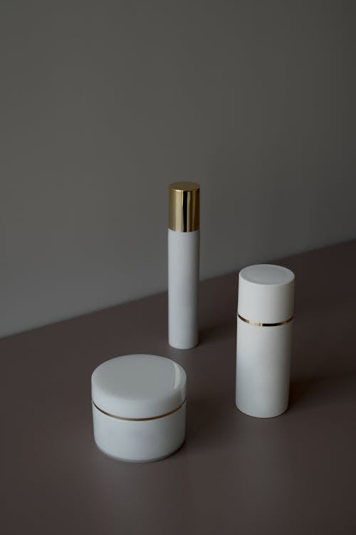 White and Gold Condiment Shakers