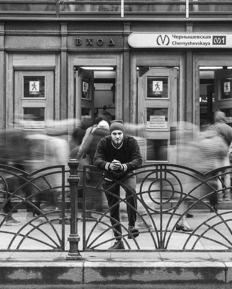 Man Standing Beside Subway Entrance