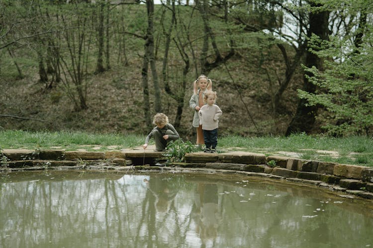 Sisters Spending Time Together By Pond