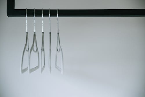 Free Clothe Hangers on a Meta Rack Stock Photo