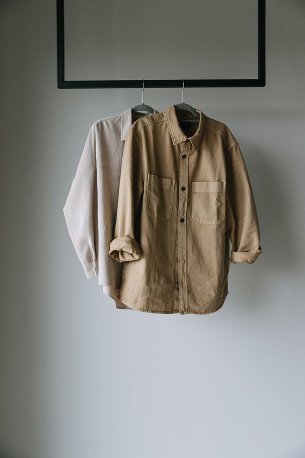 Two overshirts hanging on a wall rail — Ivan S on Pexels