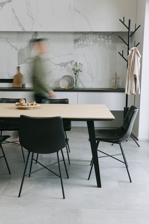 Brown Wooden Table With Black Chairs