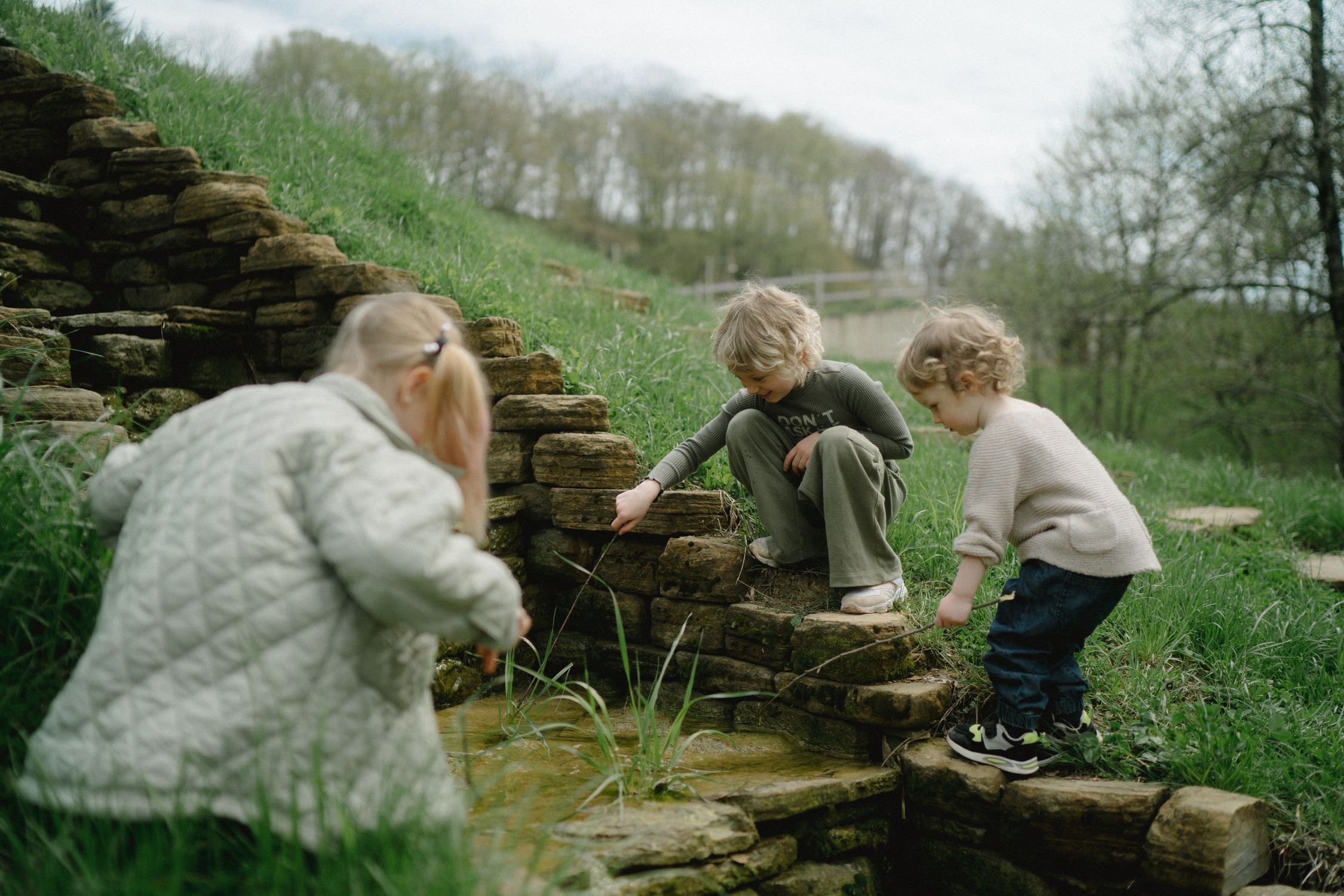 Playing In Spring Kids Playing with Springwater · Free Stock Photo