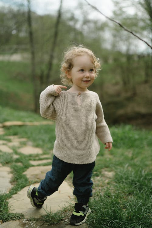 Young Boy Wearing a Knitted Sweater