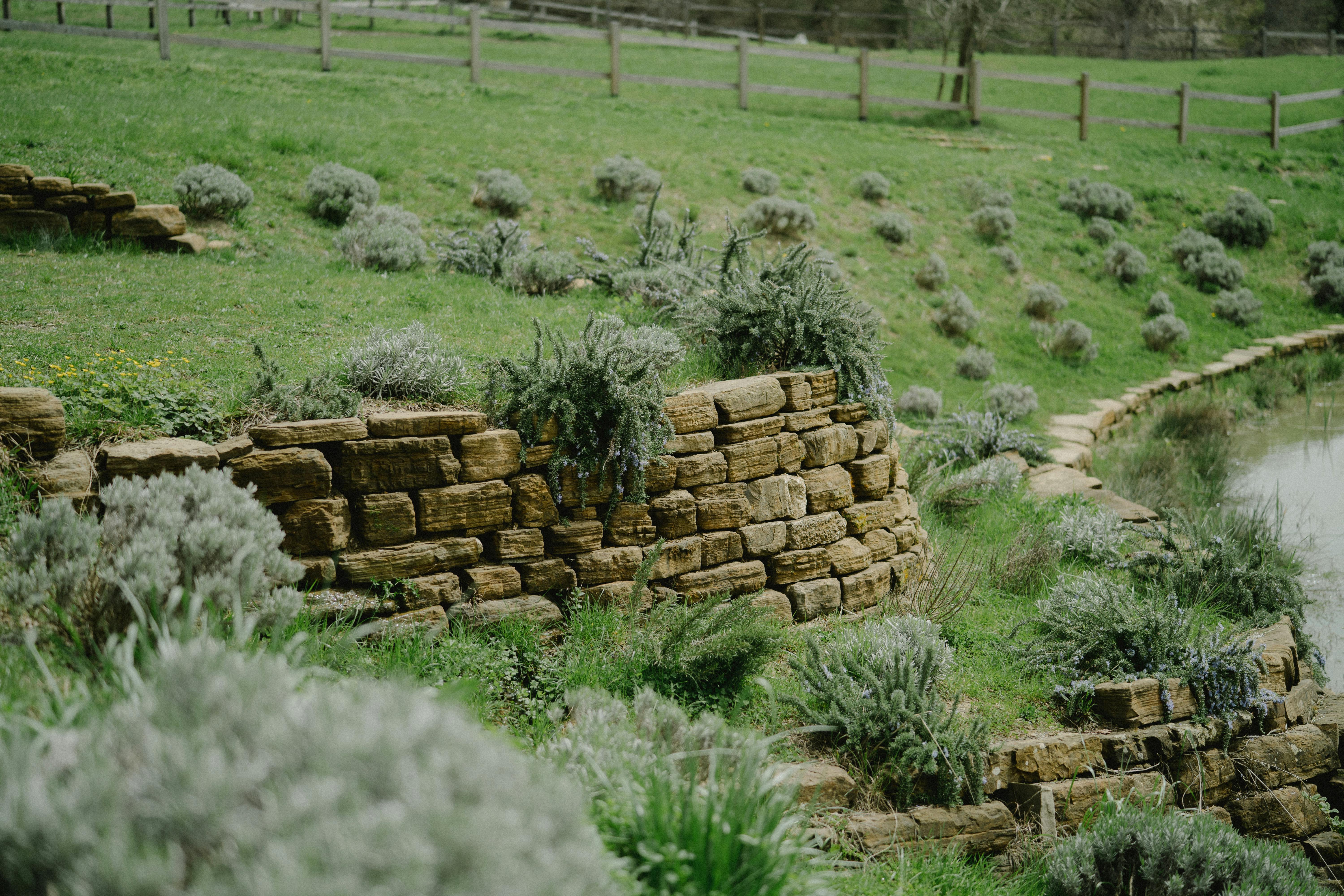 Natural stone retaining wall in a residential backyard