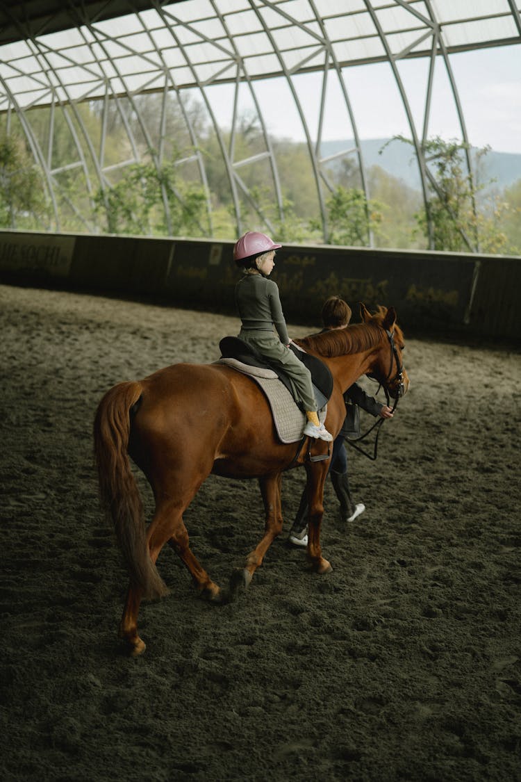 A Girl Riding A Horse