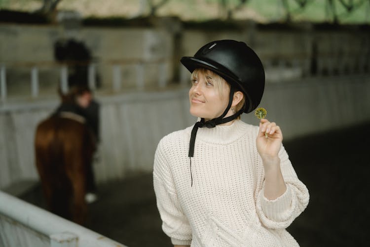 A Woman Wearing A Black Helmet