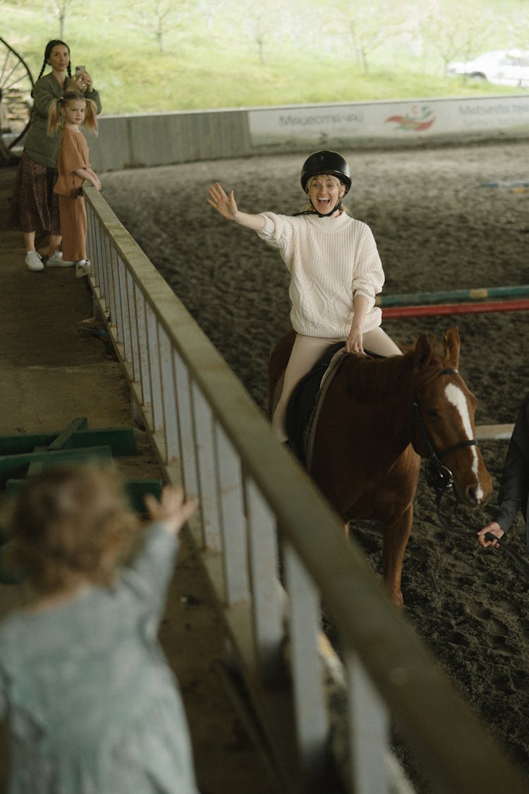 A Woman Riding A Horse