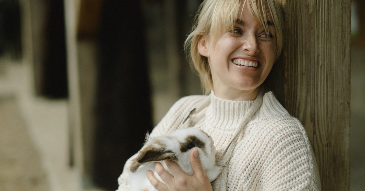 A Woman Carrying a Rabbit · Free Stock Photo