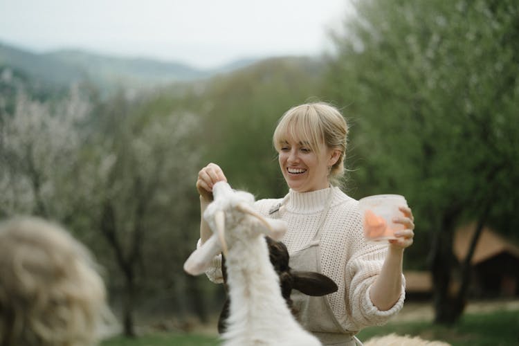 A Woman Feeding Animals