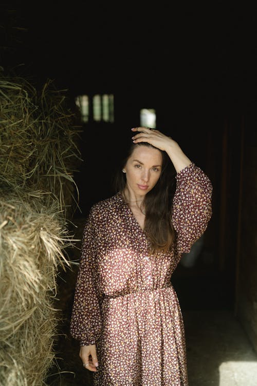 A Woman Standing Beside Haystack