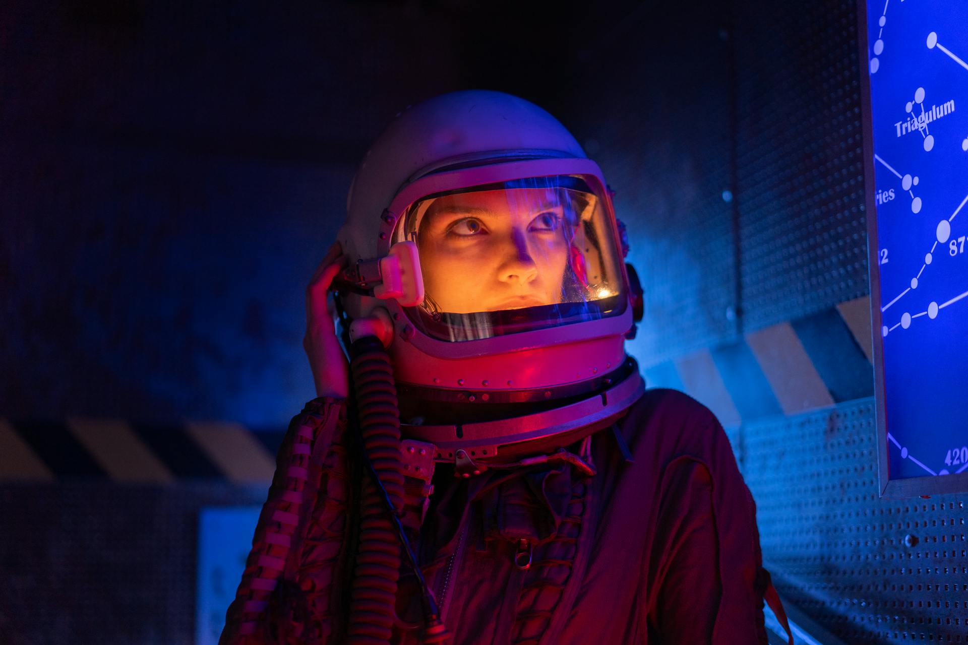 Person in Space Suit Looking At A Screen