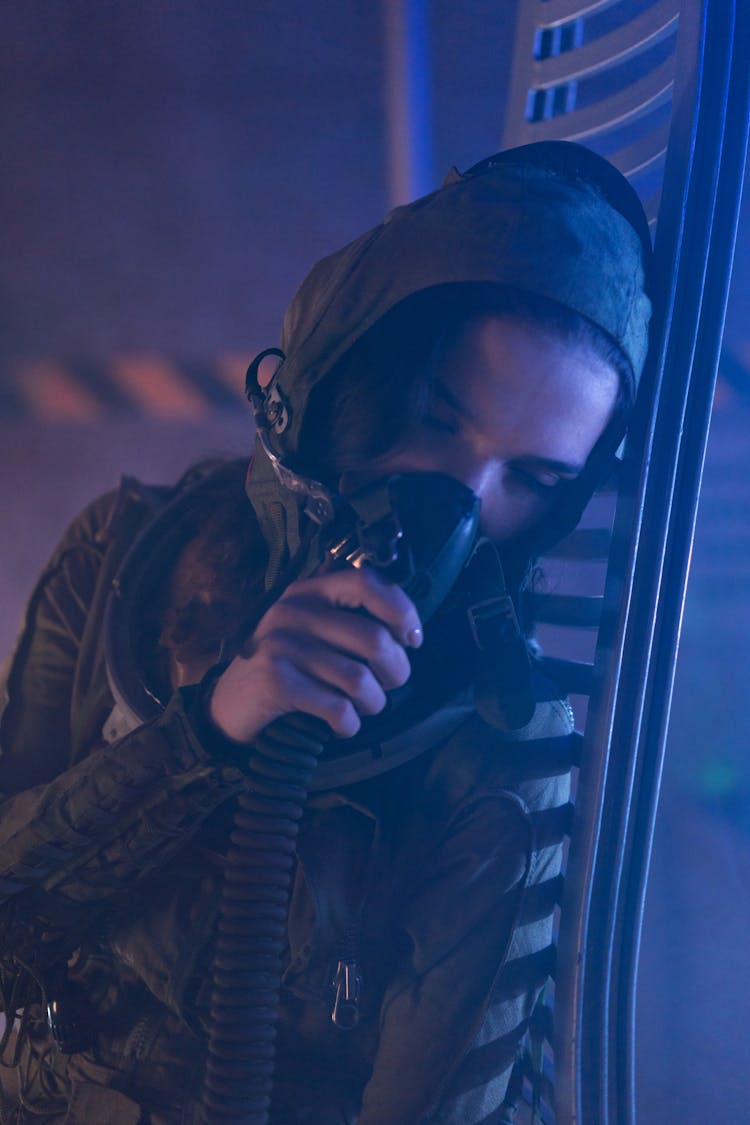 Woman In Spacesuit Breathing Oxygen