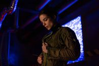 A Woman Unzipping Her Jacket