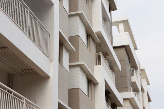 Low angle view of modern apartment buildings in Hyderabad, showcasing urban architecture and exterior design.