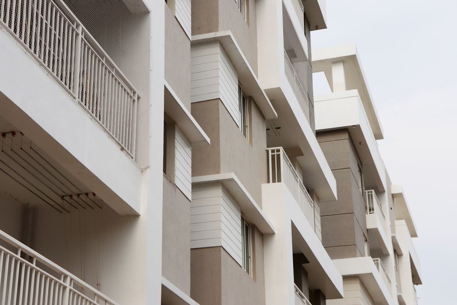 Low-angle view of modern apartment buildings against the sky