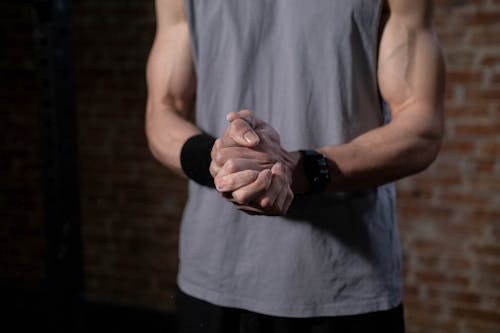 Close-Up View of a Person Clasping His Hands