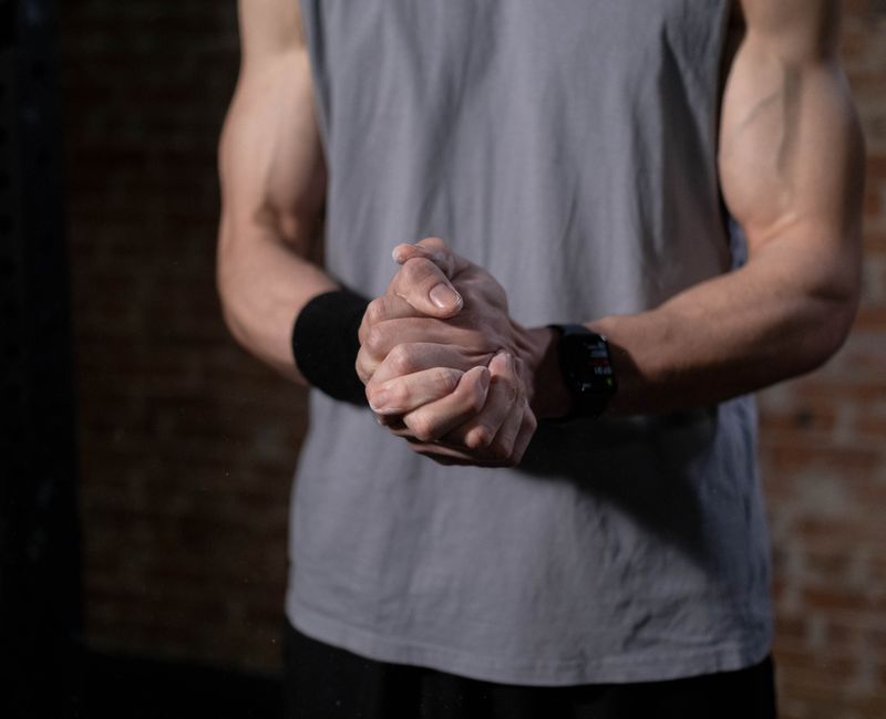 A close-up of a Super Patch applied on a person's arm during a workout