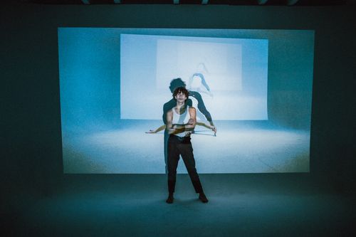 Free Dynamic photo of a young dancer posing with shadow projections indoors. Stock Photo