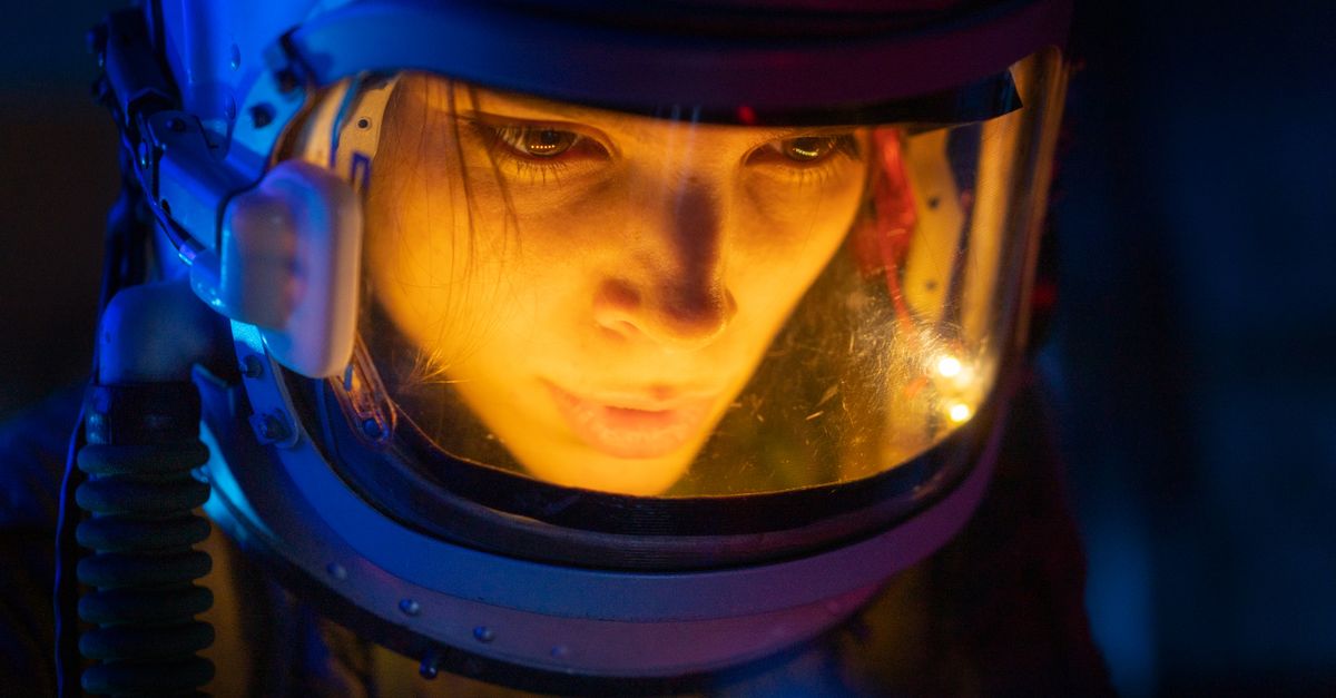 Nolan's 'The Odyssey' leads North American box office with $124.5 million opening Close-up of a woman in a space suit under blue light, looking focused and futuristic.