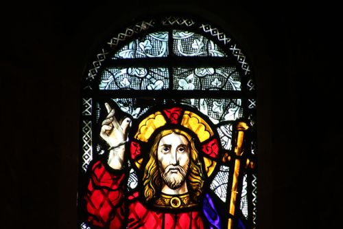 Free Vibrant stained glass depiction of Jesus Christ in Knysna, South Africa church. Stock Photo