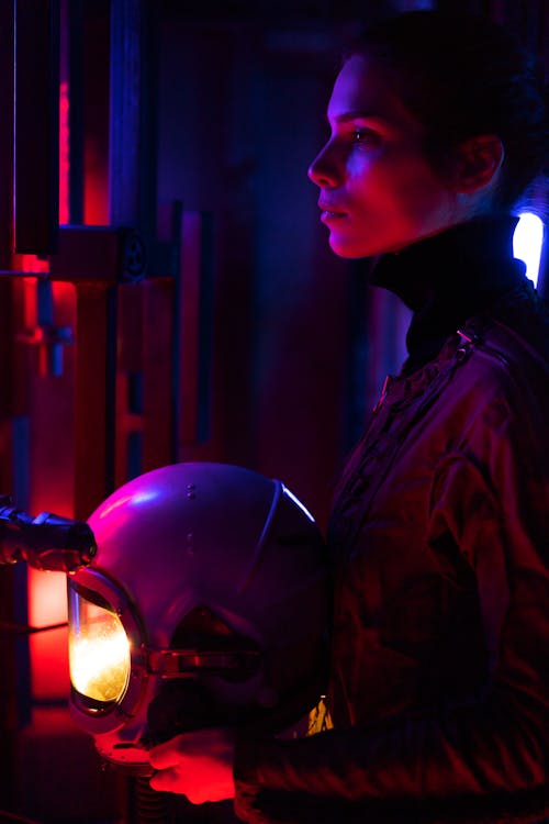 Side Profile Of A Spacewoman With Helmet
