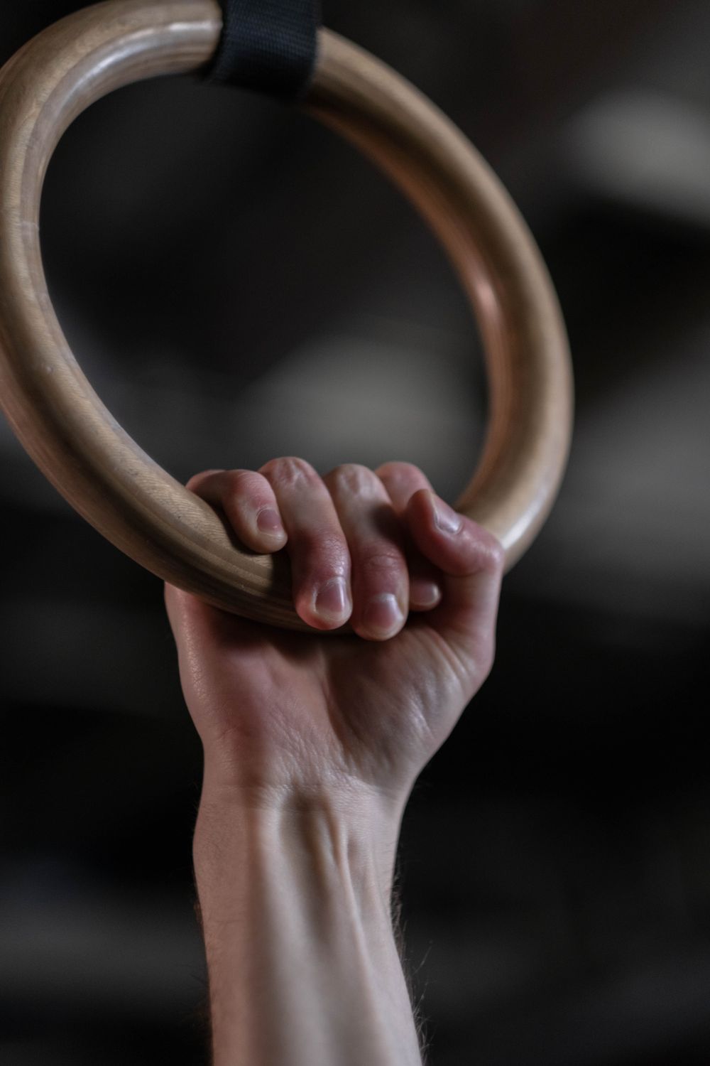 Person Holding onto Gymnastic Rings · Free Stock Photo