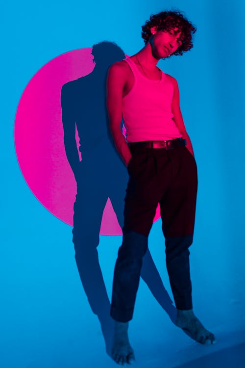 Free Man in Pink Tank Top and Black Pants Standing Stock Photo