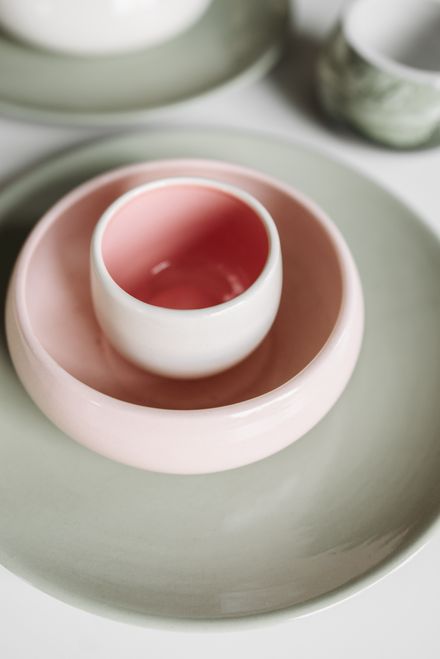Handmade ceramic bowls and cups in soft pastel glazes — photo by Pavel Danilyuk on Pexels