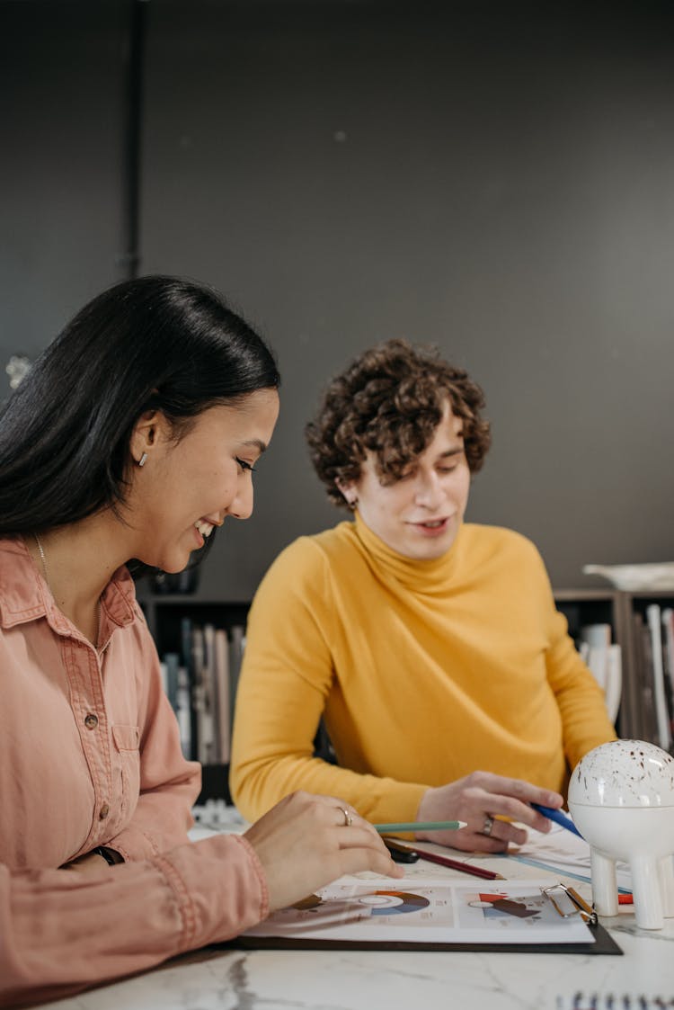 A Man And Woman Working Together 