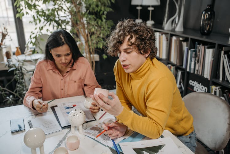 A Man And Woman Working Together