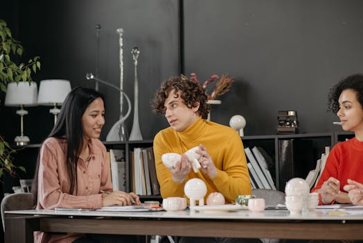 Diverse team discussing a creative project in a stylish office setting.