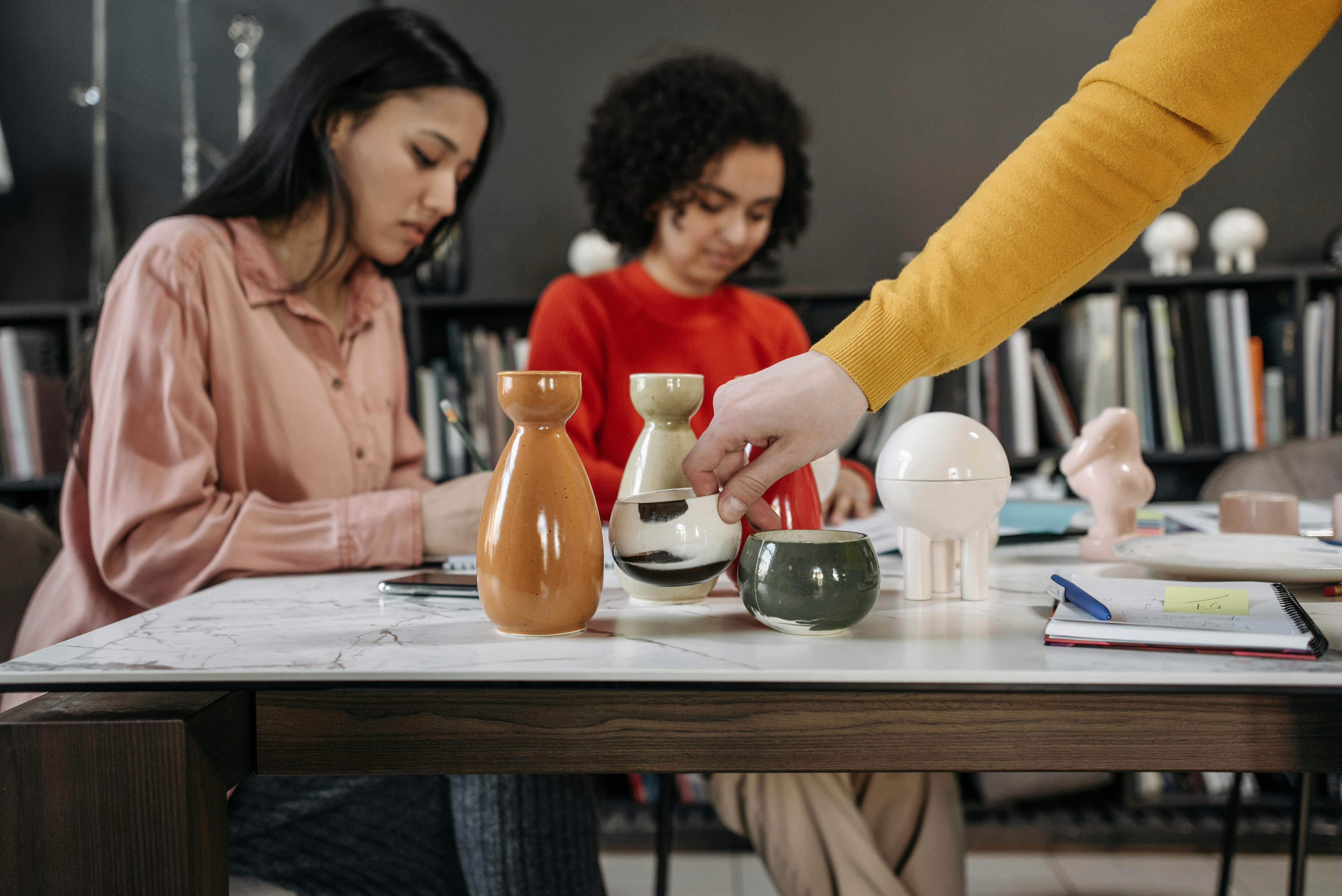 A compassionate therapist listens to a patient in a sunlit room.