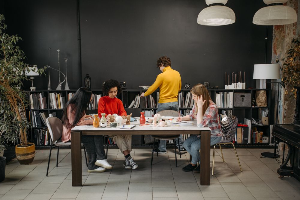 Studio team around a work table — photo by Pavel Danilyuk on Pexels