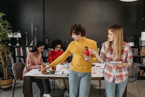 A Group of People Having a Meeting in the Office