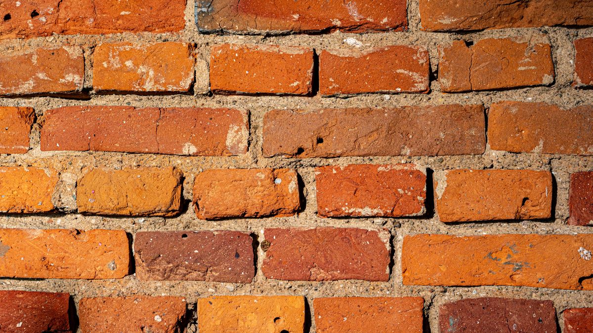 Close view of brick coursework with thick mortar joints