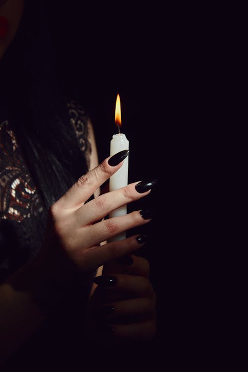 Woman Holding a Lighted Candle